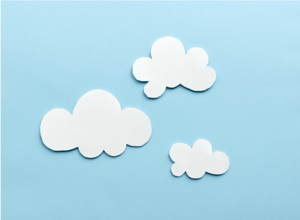 Paper clouds appear on a blue paper background