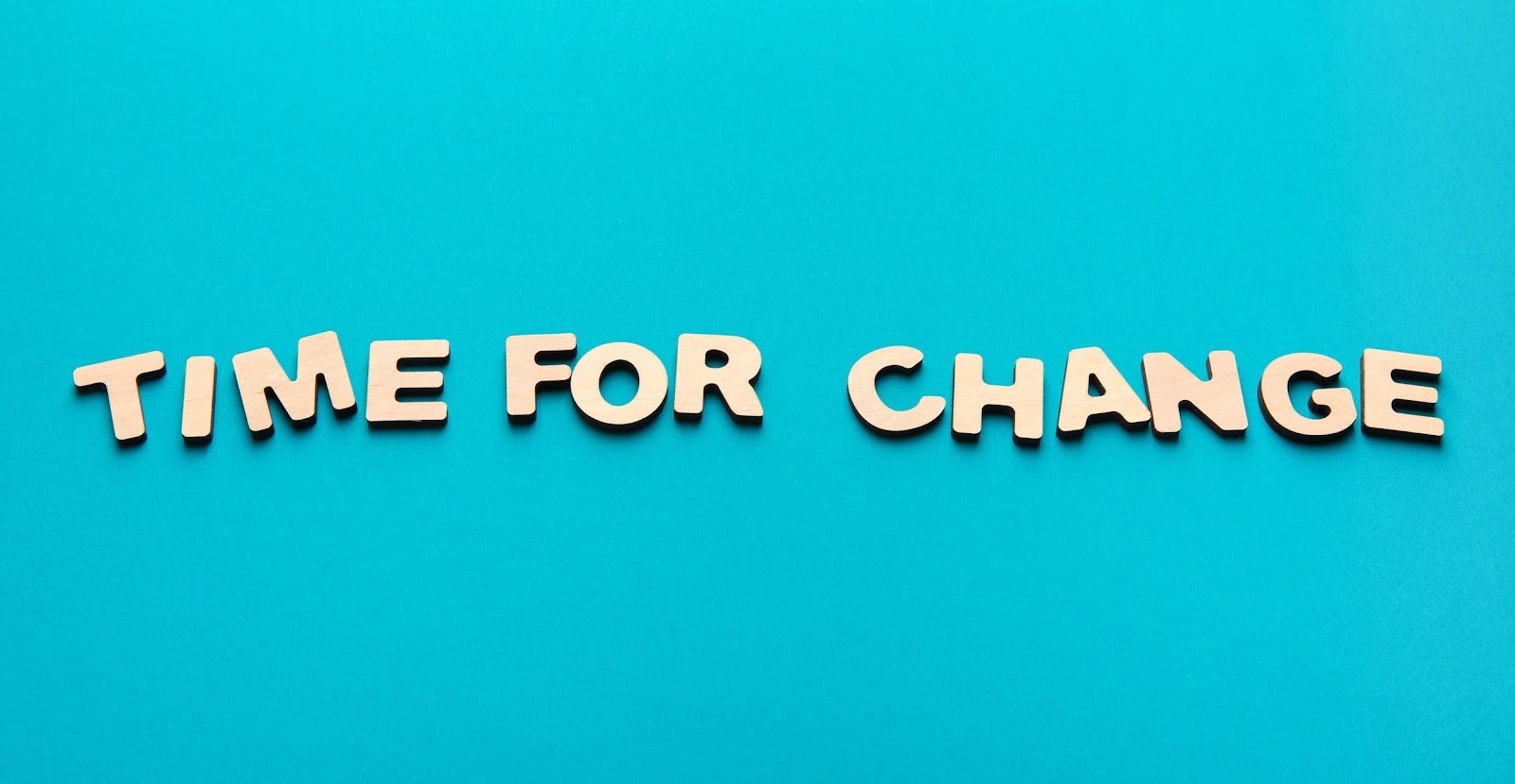 "Time for change" in block letters on a blue backdrop 