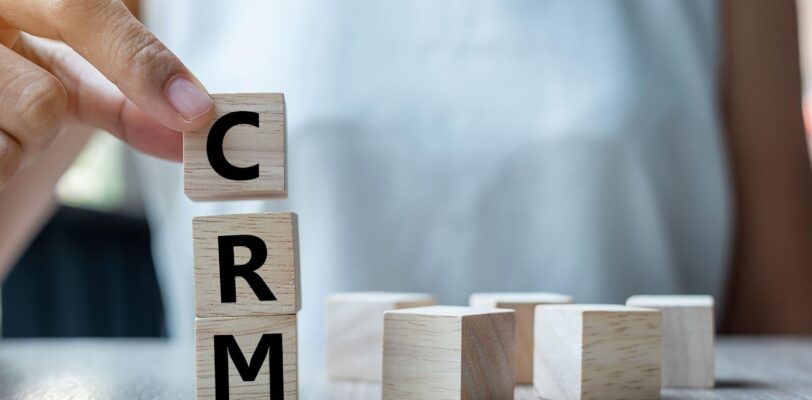 building blocks are stacked to spell "CRM"
